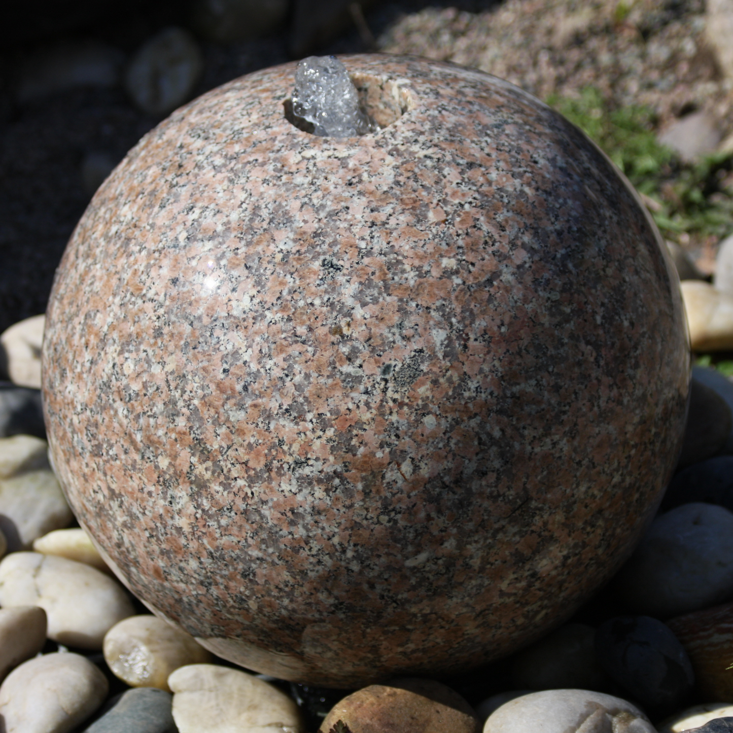 Polished Drilled Pink Granite Sphere