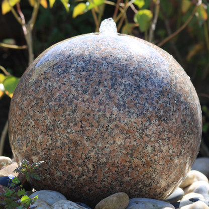 Polished Drilled Pink Granite Sphere